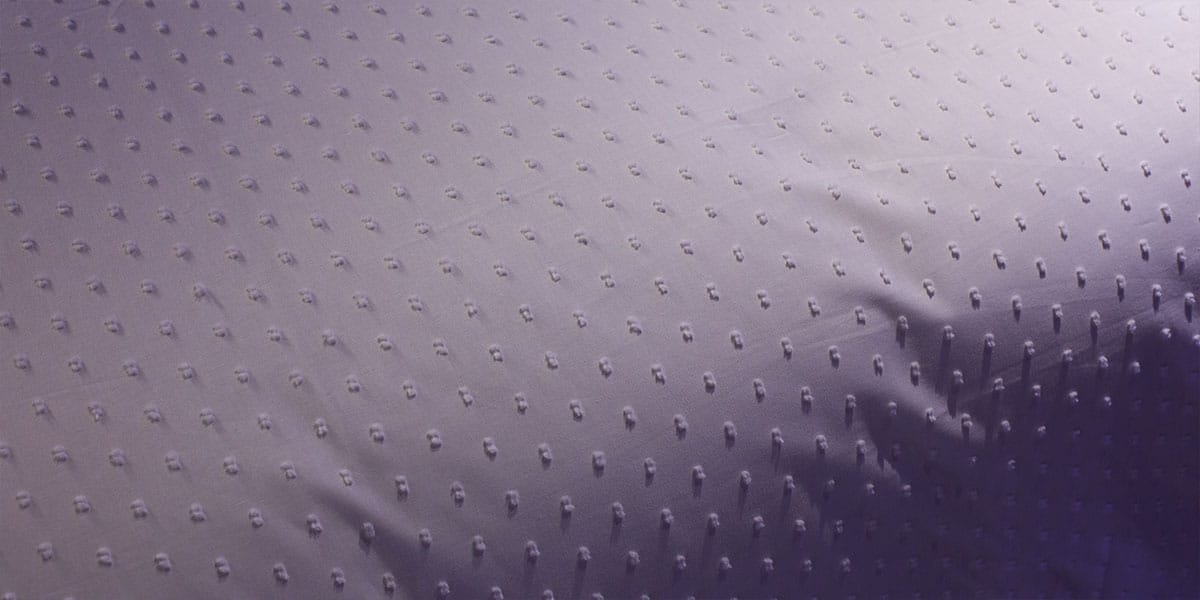 Detail foto van een goed ademende matrasbeschermer